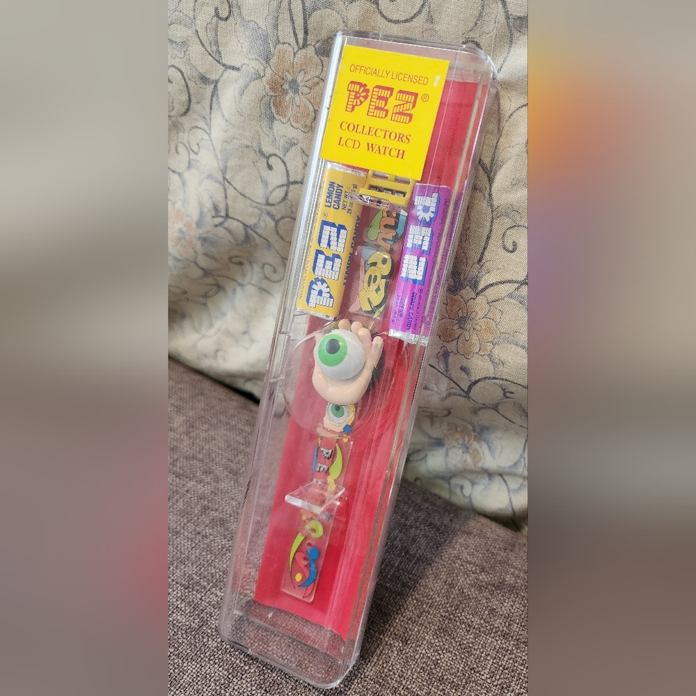 PEZ -  LCD Watch Psychedelic Green Eye Tan Hand Mint in Original Case.